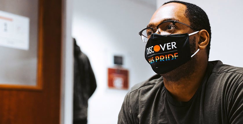 Colleague Wearing Discover Pride Face Mask