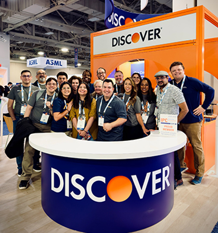 Group Of coworkers at the Discover Booth