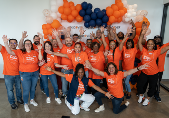 Discover employees in orange tshirts.