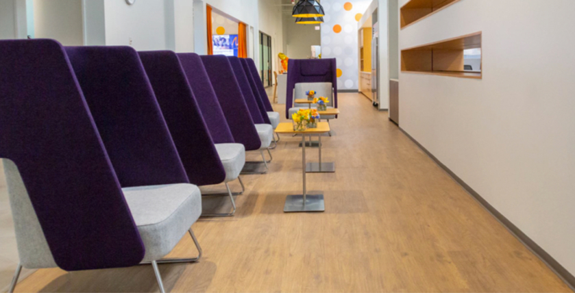 smart purple soft seats in a clean hallway with coffee tables