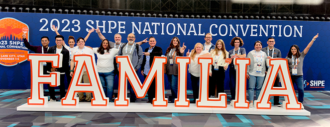 Discover coworkers Posing With A Familia Sign