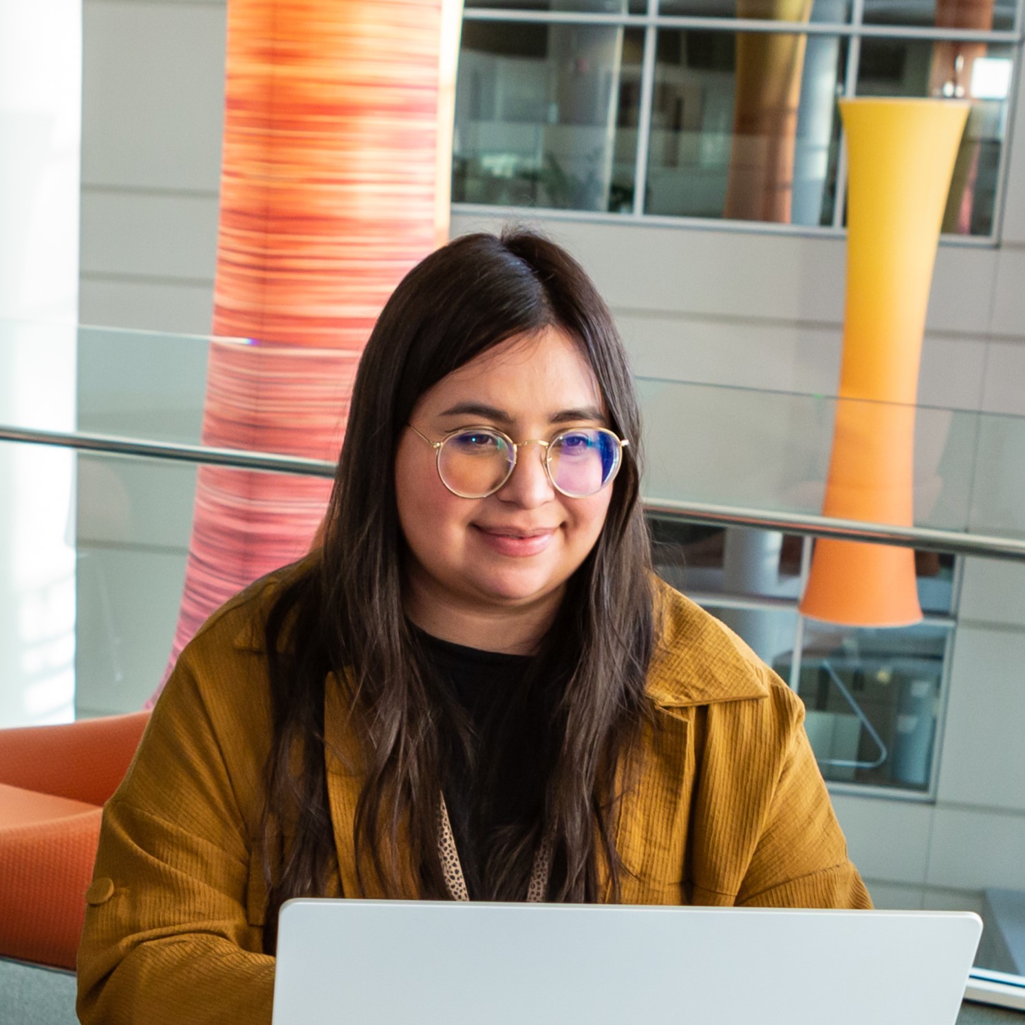 Discover employee working on her laptop