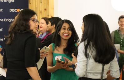 Attendees talking at a Discover Event