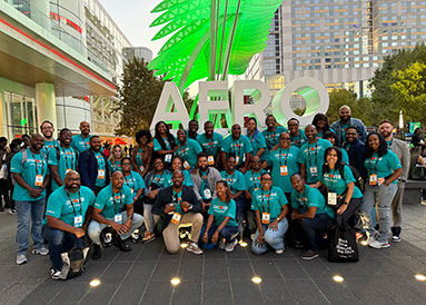 Discover Employees posing for a group shot at AfroTech 